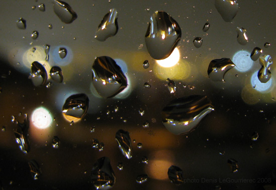 cork city lights through rain drops on a window